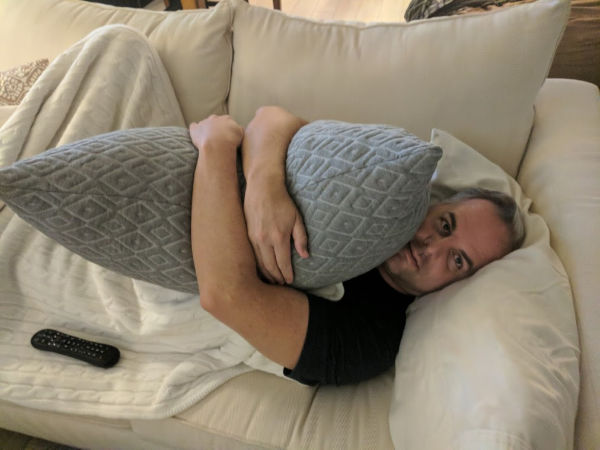 My husband hugging the Brooklyn Bedding Pillow