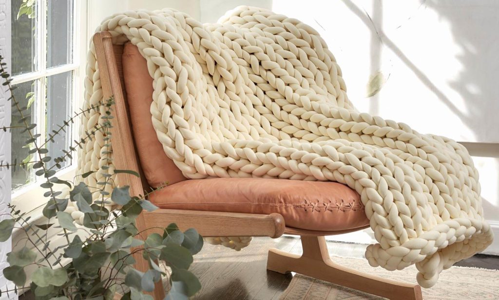cream weighted blanket on living room chair